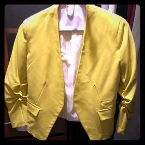 Vibrant yellow fitted blazer.